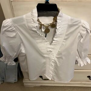 This Finley shirt is fun, flirty and feminine from upscale store. Can’t return.